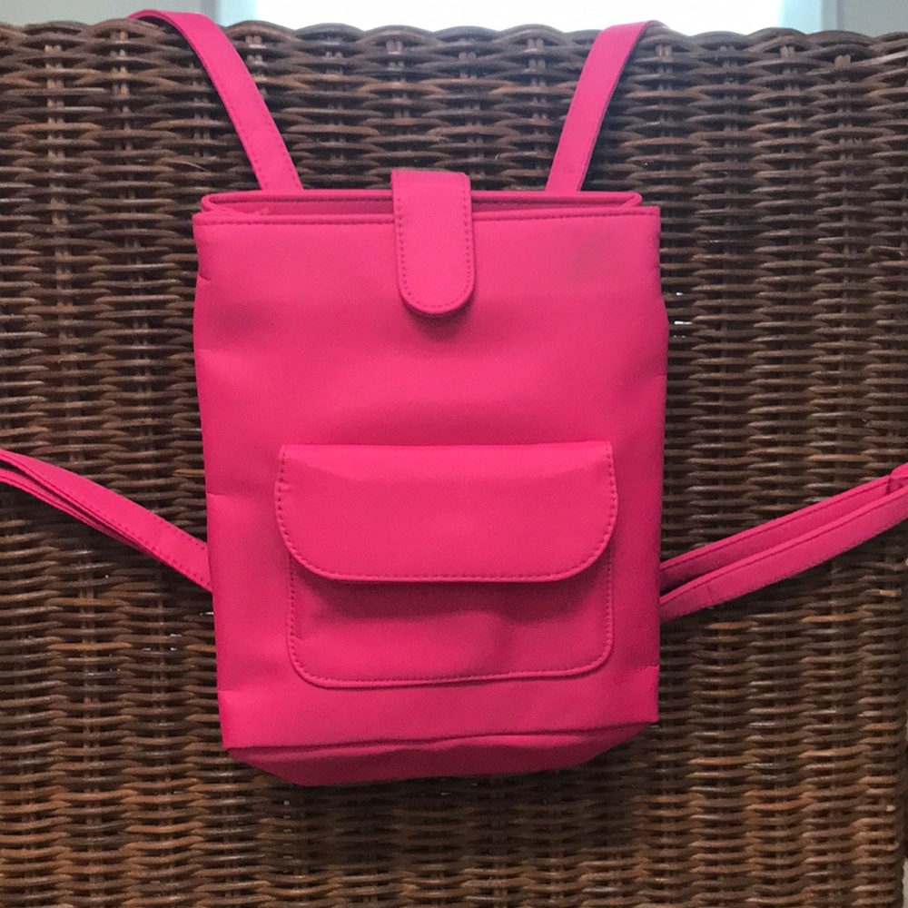 YSL mini fuschia backpack.